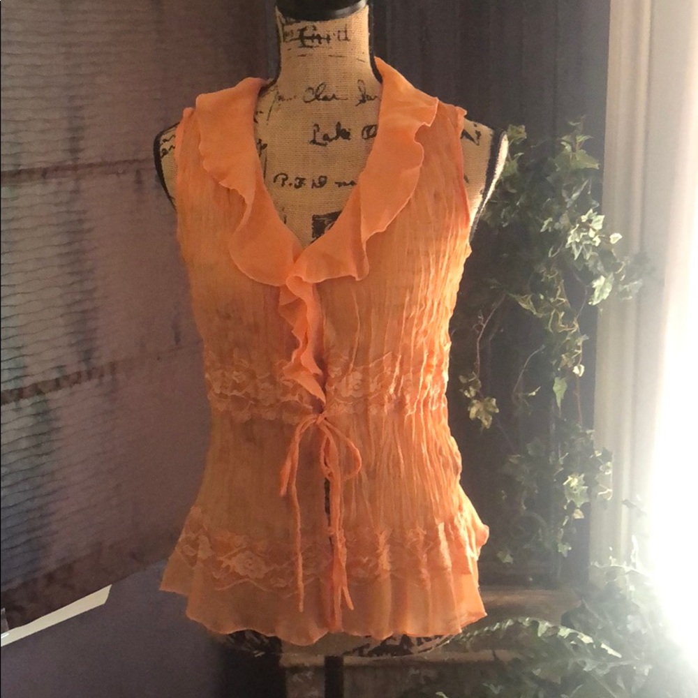 Orange sheer ruffle shirt.